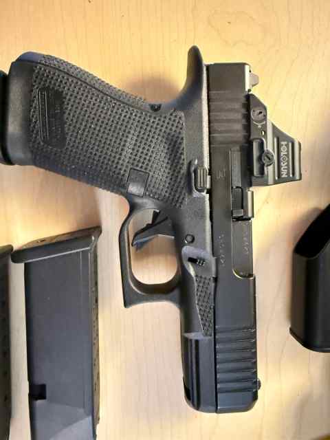 Glock 19 Gen 6 with optic and extra mags