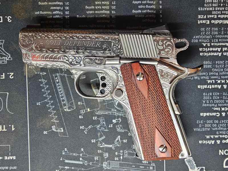 Engraved Colt Defender Lightweight 1911